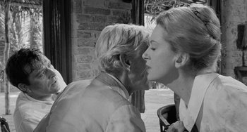 Movie still from “The Night of the Iguana” (1964), directed by John Huston – A man and a woman are kissing each other outside; Close Up shot, Over the shoulder angle