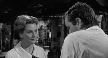 Movie still from “The Night of the Iguana” (1964), directed by John Huston – A man and a woman standing next to each other; Close Up shot, Over the shoulder angle
