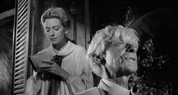 Movie still from “The Night of the Iguana” (1964), directed by John Huston – An older woman and a younger woman looking at a cell phone; Close Up shot, Low angle