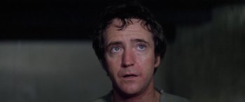 Movie still from “The Ninth Configuration” (1980), directed by William Peter Blatty – A person with blue eyes; Close Up shot, Low angle