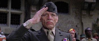 Movie still from “The Ninth Configuration” (1980), directed by William Peter Blatty – An older man in uniform saluting with one arm raised; Close Up shot, Low angle