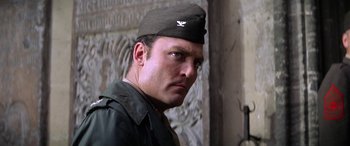 Movie still from “The Ninth Configuration” (1980), directed by William Peter Blatty – A person wearing a hat; Close Up shot, Low angle