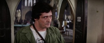 Movie still from “The Ninth Configuration” (1980), directed by William Peter Blatty – A person wearing a green jacket; Close Up shot, Low angle