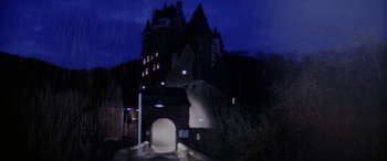 Movie still from “The Ninth Configuration” (1980), directed by William Peter Blatty – A castle like building in the night time; Extreme Wide shot, Low angle