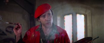 Movie still from “The Ninth Configuration” (1980), directed by William Peter Blatty – A man wearing a red hat and a red jacket; Close Up shot, Low angle