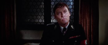 Movie still from “The Ninth Configuration” (1980), directed by William Peter Blatty – A person wearing a uniform; Close Up shot, Low angle