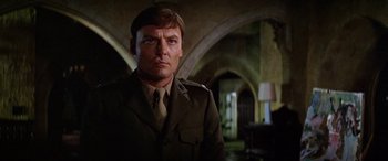 Movie still from “The Ninth Configuration” (1980), directed by William Peter Blatty – A person wearing a uniform; Close Up shot, Low angle