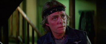 Movie still from “The Ninth Configuration” (1980), directed by William Peter Blatty – A person wearing a head band; Close Up shot, Low angle