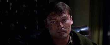Movie still from “The Ninth Configuration” (1980), directed by William Peter Blatty – A person with blood on his face; Close Up shot, Low angle