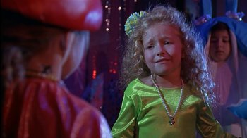 Movie still from “The Object of My Affection” (1998), directed by Nicholas Hytner – A little girl in a lime green dress; Close Up shot, Over the shoulder angle
