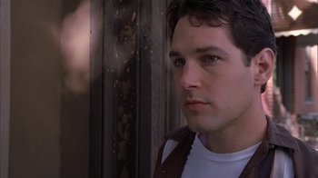 Movie still from “The Object of My Affection” (1998), directed by Nicholas Hytner – A person wearing a vest; Close Up shot, Low angle