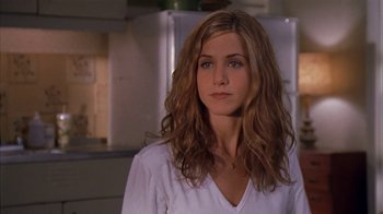 Movie still from “The Object of My Affection” (1998), directed by Nicholas Hytner – A person wearing a white shirt; Close Up shot, Over the shoulder angle