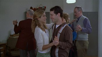 Movie still from “The Object of My Affection” (1998), directed by Nicholas Hytner – A man and a woman dancing in a room; Medium shot, Over the shoulder angle