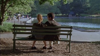 Movie still from “The Object of My Affection” (1998), directed by Nicholas Hytner – A man and a woman sitting on a park bench; Wide shot, High angle