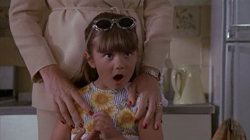 Movie still from “The Object of My Affection” (1998), directed by Nicholas Hytner – A young girl is being hugged by her mother; Close Up shot, High angle