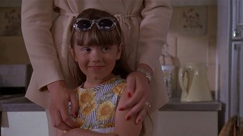 Movie still from “The Object of My Affection” (1998), directed by Nicholas Hytner – A young girl is being hugged by a woman; Close Up shot, Over the shoulder angle