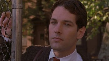 Movie still from “The Object of My Affection” (1998), directed by Nicholas Hytner – A person wearing a suit and tie; Close Up shot, Over the shoulder angle