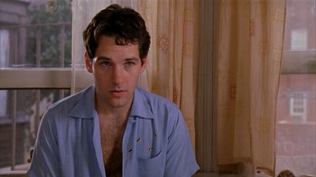 Movie still from “The Object of My Affection” (1998), directed by Nicholas Hytner – A man sitting in front of a window; Close Up shot, Low angle