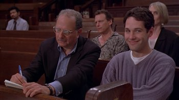 Movie still from “The Object of My Affection” (1998), directed by Nicholas Hytner – Three men sitting at a table in front of each other; Medium shot, Over the shoulder angle