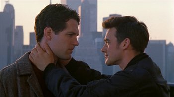 Two young men touching each other's necks