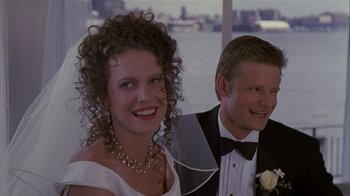 Movie still from “The Object of My Affection” (1998), directed by Nicholas Hytner – A man and a woman smiling for a picture; Close Up shot, High angle