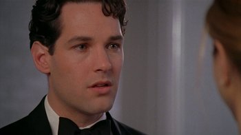 Movie still from “The Object of My Affection” (1998), directed by Nicholas Hytner – A person wearing a tuxedo; Close Up shot, Over the shoulder angle