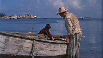 Movie still from “The Old Man and the Sea” (1958), directed by Fred Zinnemann – Two people in a boat on the water; Wide shot, High angle