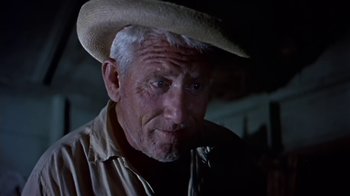 Movie still from “The Old Man and the Sea” (1958), directed by Fred Zinnemann – An older man wearing a straw hat and looking at the camera; Close Up shot, Low angle