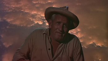 Movie still from “The Old Man and the Sea” (1958), directed by Fred Zinnemann – An older man wearing a cowboy hat in front of a cloudy sky; Close Up shot, Low angle