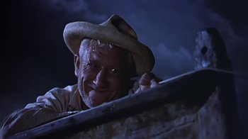 Movie still from “The Old Man and the Sea” (1958), directed by Fred Zinnemann – A man in a cowboy hat is smiling for the camera; Close Up shot, Low angle