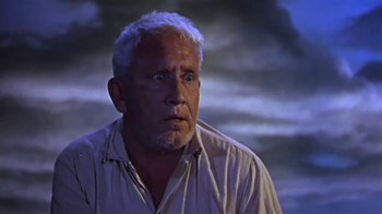 Movie still from “The Old Man and the Sea” (1958), directed by Fred Zinnemann – An older man with white hair stares into the distance; Close Up shot, Low angle