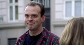 Movie still from “The One and Only” (1999), directed by Susanne Bier – A person wearing a plaid shirt; Close Up shot, Low angle