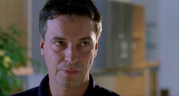Movie still from “The One and Only” (1999), directed by Susanne Bier – A person looking at the camera; Close Up shot, Low angle