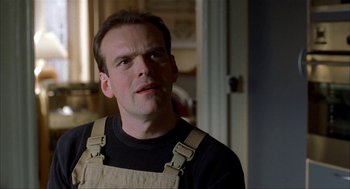 Movie still from “The One and Only” (1999), directed by Susanne Bier – A person wearing a black shirt; Close Up shot, Low angle