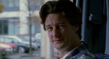 Movie still from “The One and Only” (1999), directed by Susanne Bier – A person wearing a plaid shirt; Close Up shot, Over the shoulder angle