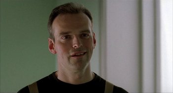 Movie still from “The One and Only” (1999), directed by Susanne Bier – A person wearing a black t - shirt; Close Up shot, Low angle