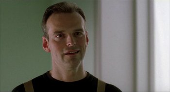 Movie still from “The One and Only” (1999), directed by Susanne Bier – A person wearing a black t - shirt; Close Up shot, Low angle