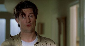 Movie still from “The One and Only” (1999), directed by Susanne Bier – A person wearing a jacket; Close Up shot, Low angle