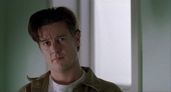 Movie still from “The One and Only” (1999), directed by Susanne Bier – A person wearing a shirt and a jacket; Close Up shot, Low angle