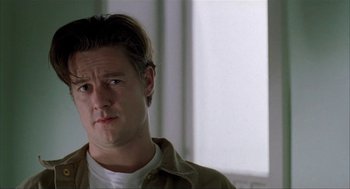 Movie still from “The One and Only” (1999), directed by Susanne Bier – A person wearing a shirt; Close Up shot, Low angle