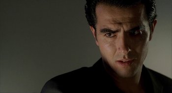 Movie still from “The One and Only” (1999), directed by Susanne Bier – A person wearing a black shirt; Close Up shot, Low angle