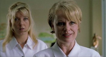 Movie still from “The One and Only” (1999), directed by Susanne Bier – Two women standing next to each other in a room; Close Up shot, Low angle