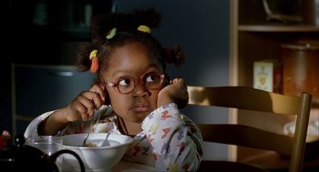 Movie still from “The One and Only” (1999), directed by Susanne Bier – A little girl sitting at a table with a bowl of cereal; Close Up shot, High angle