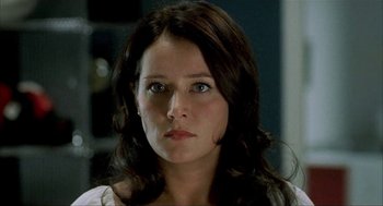 Movie still from “The One and Only” (1999), directed by Susanne Bier – A person with long brown hair; Close Up shot, Over the shoulder angle