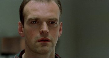 Movie still from “The One and Only” (1999), directed by Susanne Bier – A person with a beard; Close Up shot, Low angle