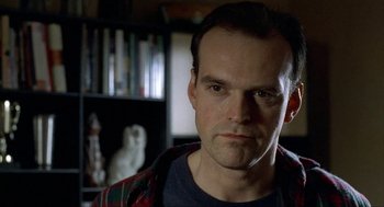 Movie still from “The One and Only” (1999), directed by Susanne Bier – A person wearing a plaid shirt; Close Up shot, Low angle