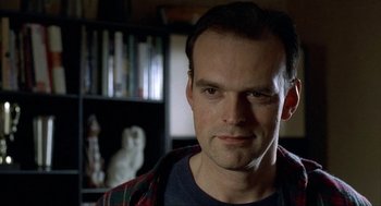 Movie still from “The One and Only” (1999), directed by Susanne Bier – A person wearing a plaid shirt; Close Up shot, Low angle