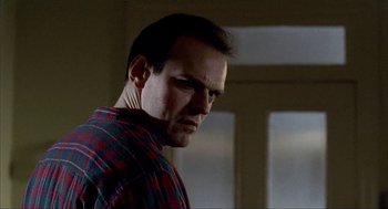 Movie still from “The One and Only” (1999), directed by Susanne Bier – A person wearing a plaid shirt; Close Up shot, Low angle