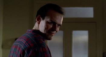 Movie still from “The One and Only” (1999), directed by Susanne Bier – A person wearing a plaid shirt; Close Up shot, Low angle