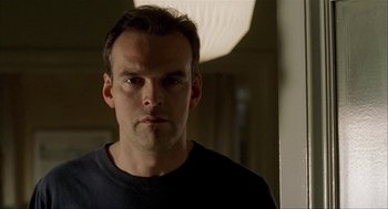 Movie still from “The One and Only” (1999), directed by Susanne Bier – A person wearing a black t - shirt; Close Up shot, Low angle